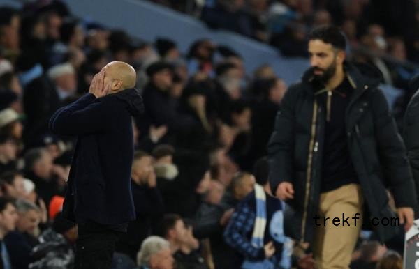 Manchester City manager Pep Guardiola (left) reacts after Matheus Nunes co<em></em>ncedes a penalty against Manchester United<em></em>'s Amad Diallo. — Reuters pic