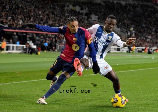 Barcelona<em></em>'s forward Raphinha fights for the ball with Leganes<em></em>' midfielder Seydouba Cisse during the Spanish league football match between FC Barcelona and Club Deportivo Leganes SAD at the Estadi Olimpic Lluis Companys in Barcelona on December 15, 2024. — AFP pic