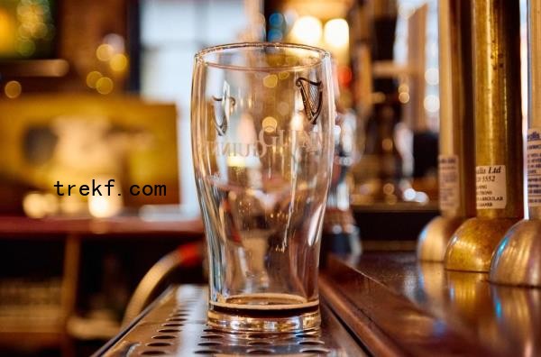 An empty Guinness glass, seen behind the bar inside The Old Ivy House public house in Clerkenwell, Lo<em></em>ndon December 15, 2024. — AFP pic