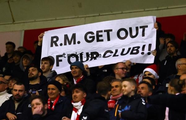 A Southampton fan displays a banner for manager Russell Martin in the stands. — Reuters pic